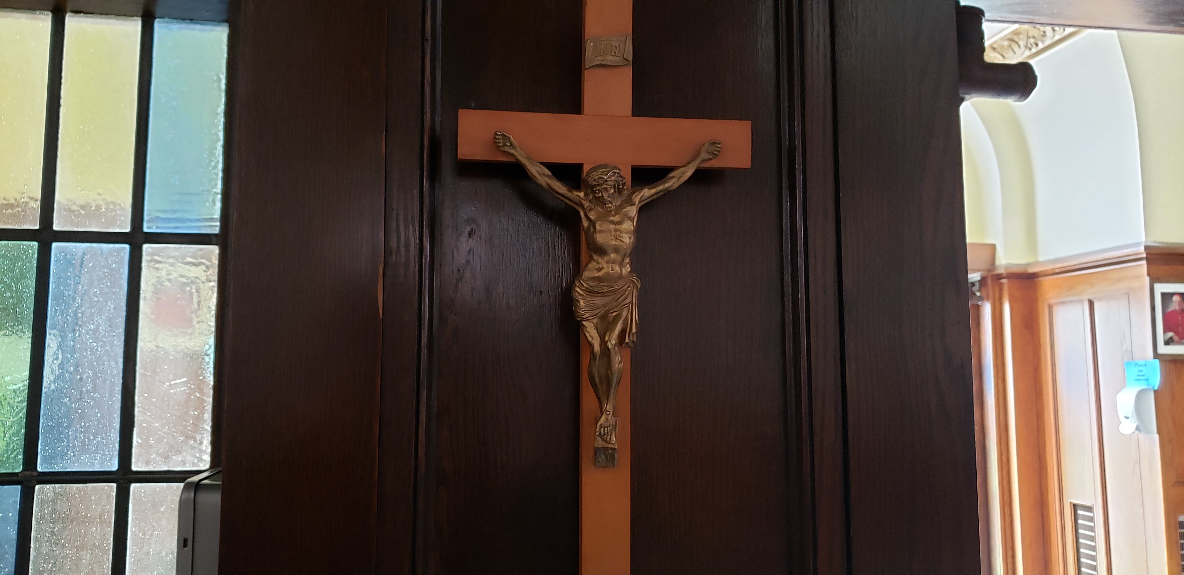 Crucifix on a brown door